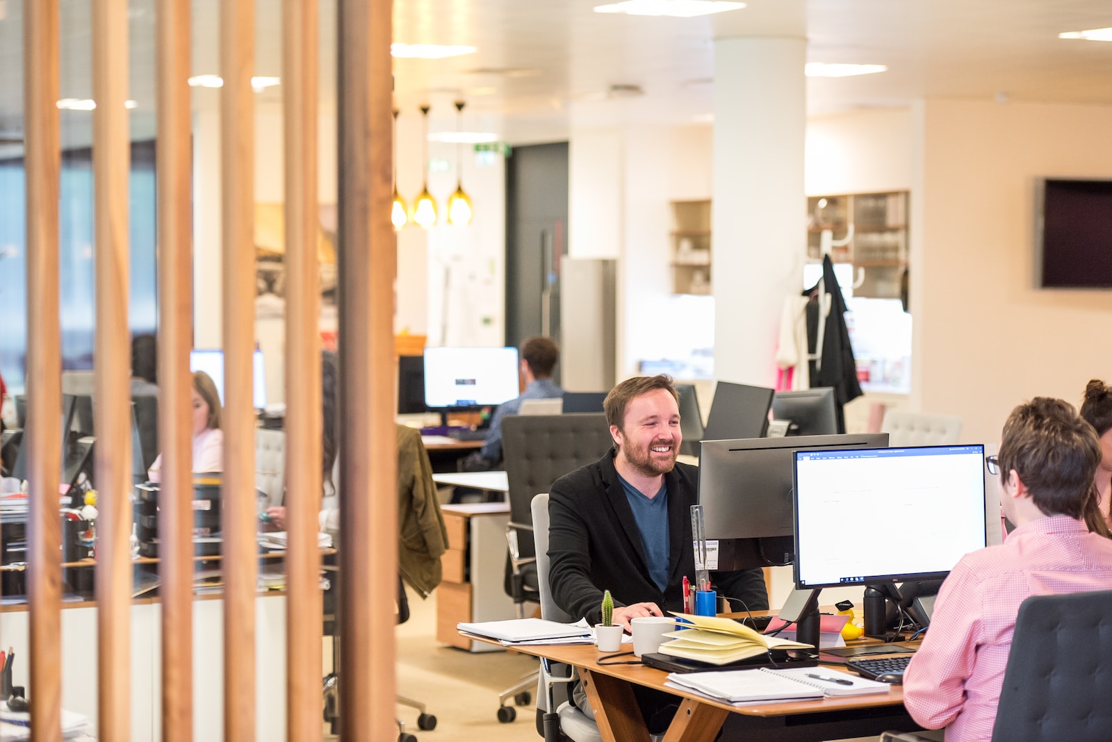 a man sitting at a desk in an office